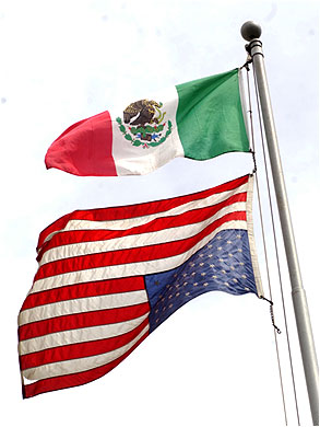 Mexican Flag Flown Above Upside Down American Flag